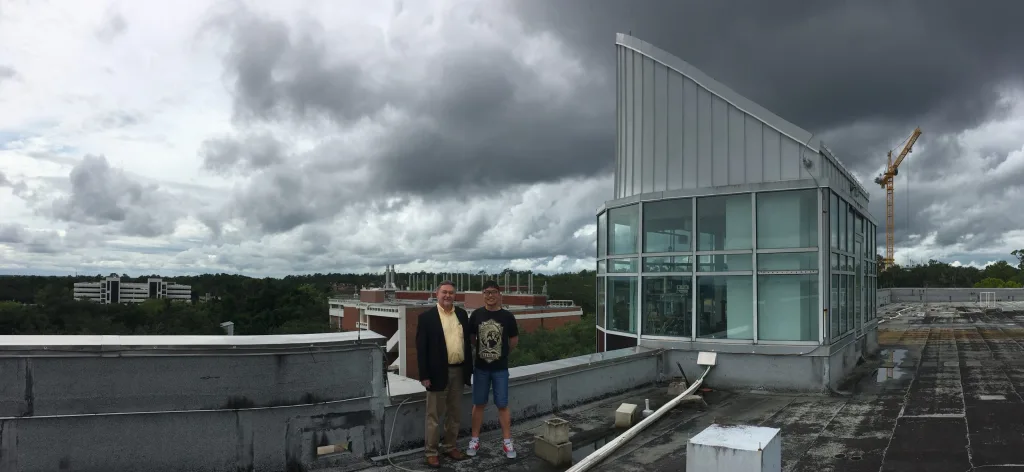 Dr. Vladimir Rakov and PhD student Ziqin Ding in the cupola atop the New Engineering Building (NEB)